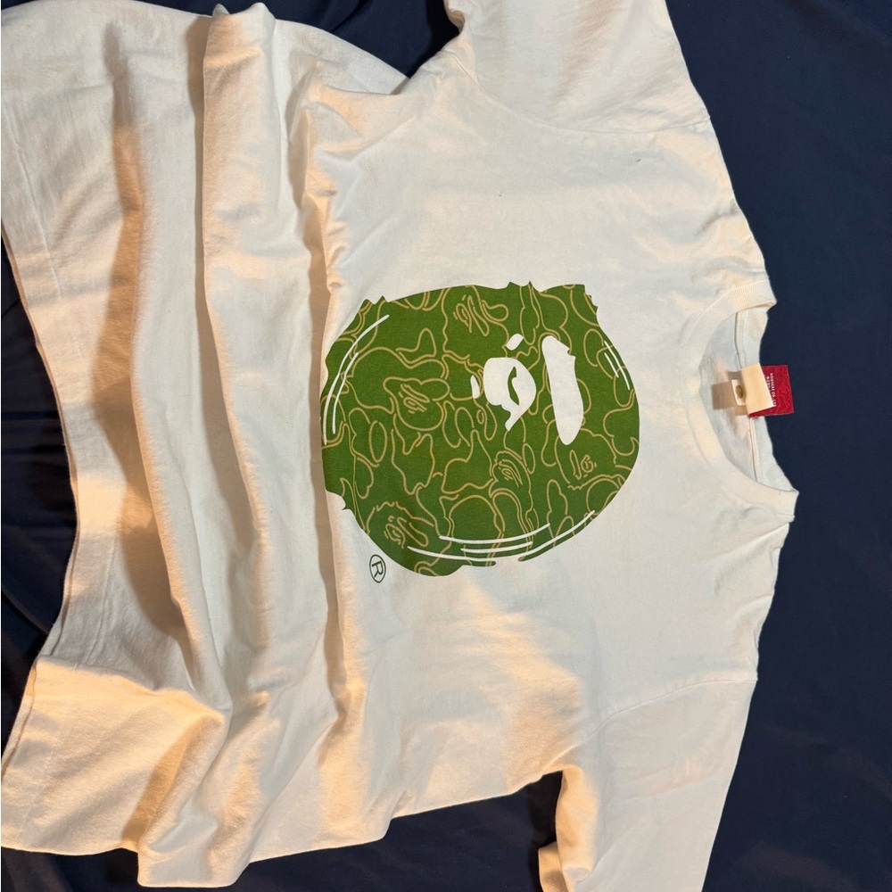White T-Shirt with Green Graphic